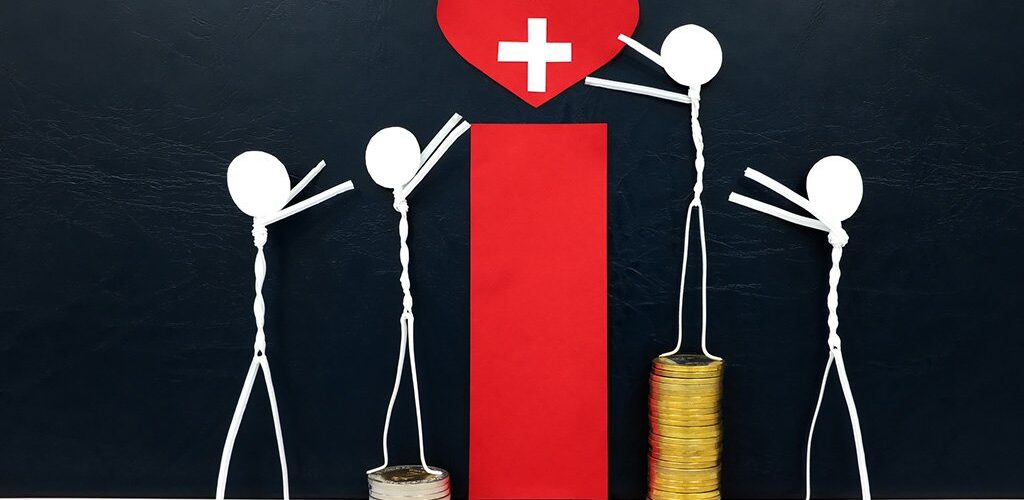 Four stick figures reaching for a red heart shape with healthcare cross cutout, while stepping on stacks of coins of various heights, symbolizing cost’s role in access to healthcare.